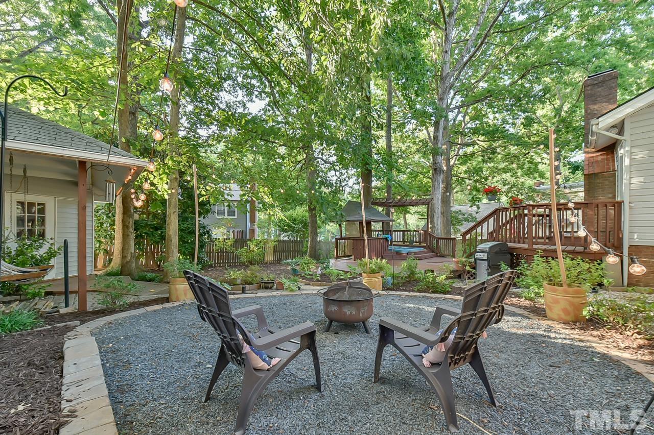 7204 Ray Road Raleigh, NC 27613 - Photo 9 of 40 a view of a house with backyard and sitting area