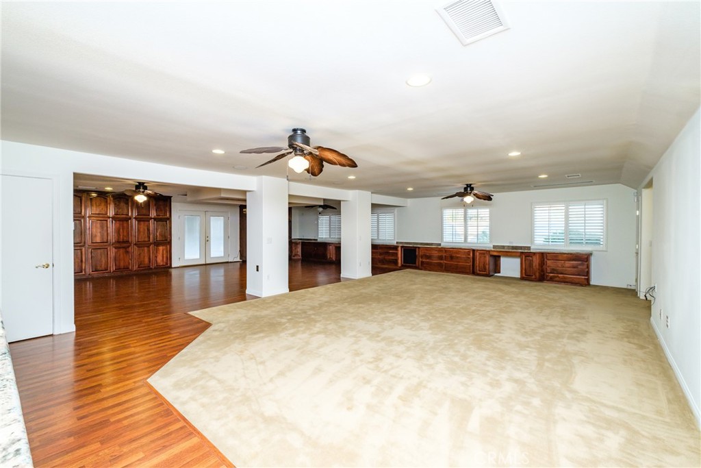 19670 Tonkawan Road Apple Valley, CA 92307 - Photo 12 of 29 a big room with wooden floor and windows