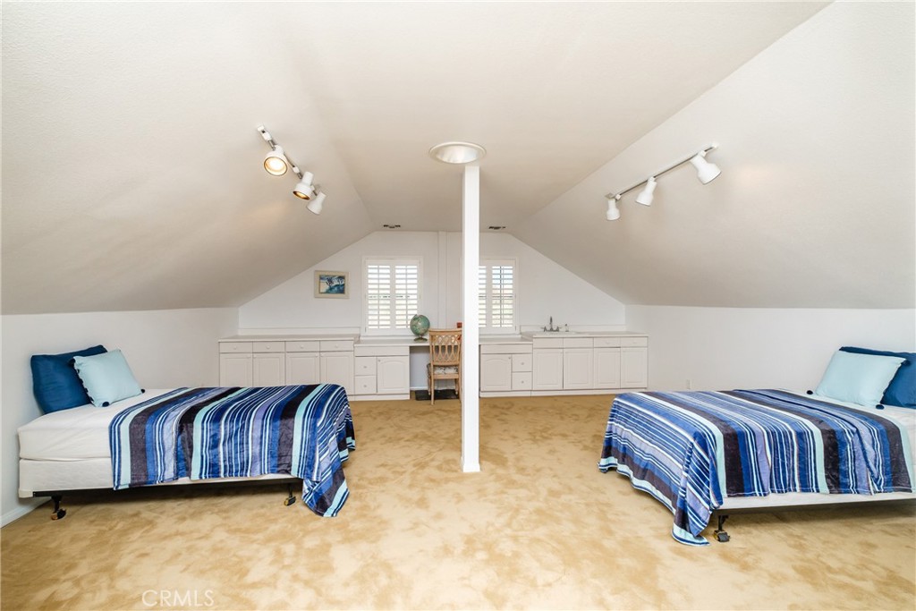 19670 Tonkawan Road Apple Valley, CA 92307 - Photo 14 of 29 a spacious bedroom with a bed and window