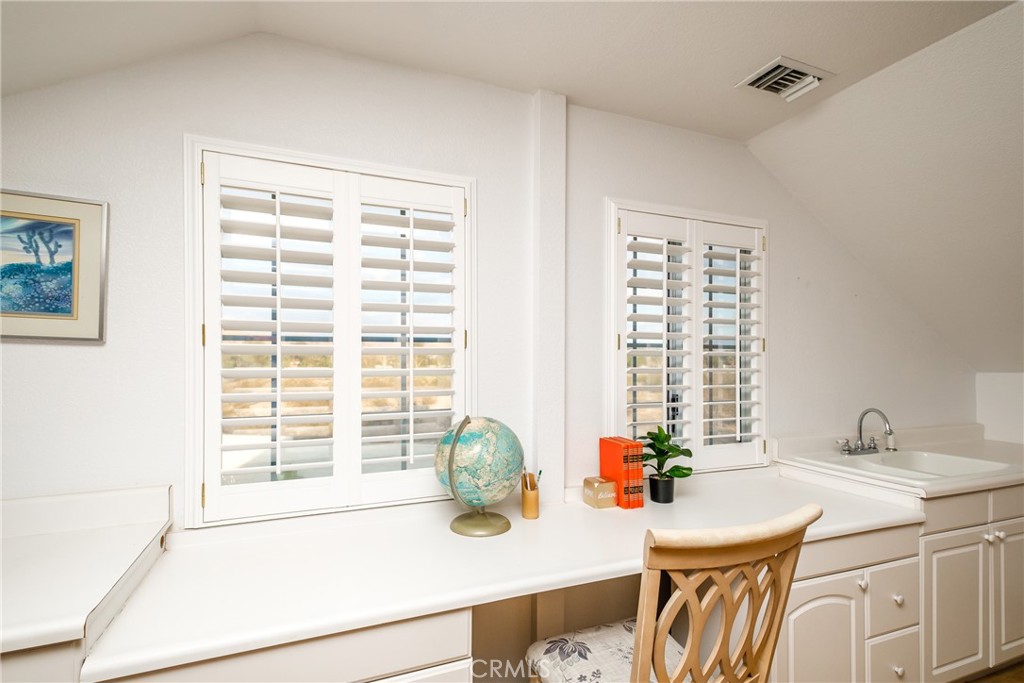 19670 Tonkawan Road Apple Valley, CA 92307 - Photo 15 of 29 a kitchen with a sink and a window