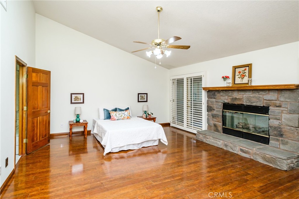 19670 Tonkawan Road Apple Valley, CA 92307 - Photo 17 of 29 a bedroom with a bed and a fireplace