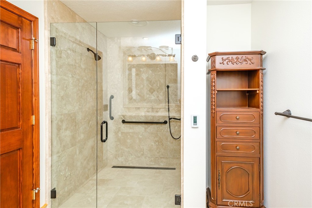 19670 Tonkawan Road Apple Valley, CA 92307 - Photo 22 of 29 a bathroom with a shower and a sink