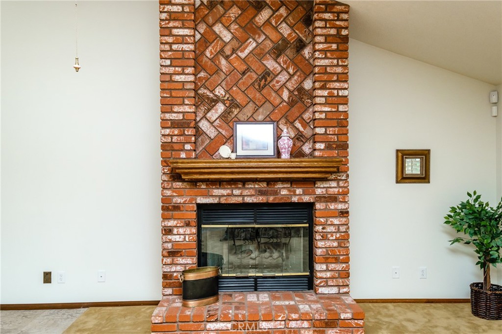 19670 Tonkawan Road Apple Valley, CA 92307 - Photo 3 of 29 a living room with a fireplace