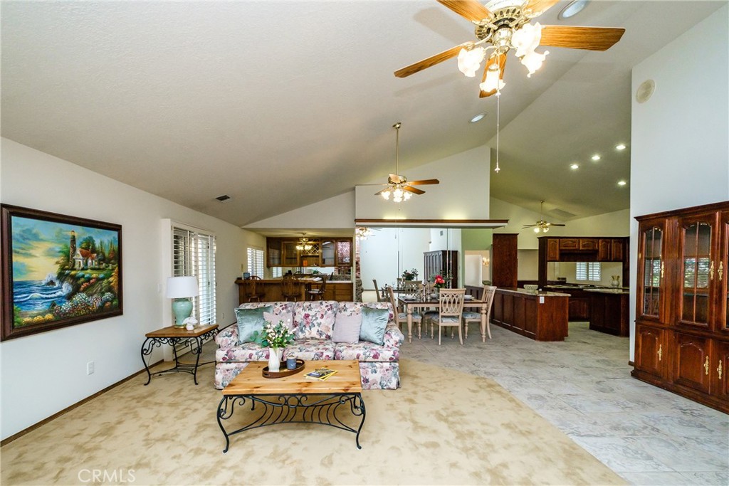 19670 Tonkawan Road Apple Valley, CA 92307 - Photo 4 of 29 a living room with furniture and kitchen view