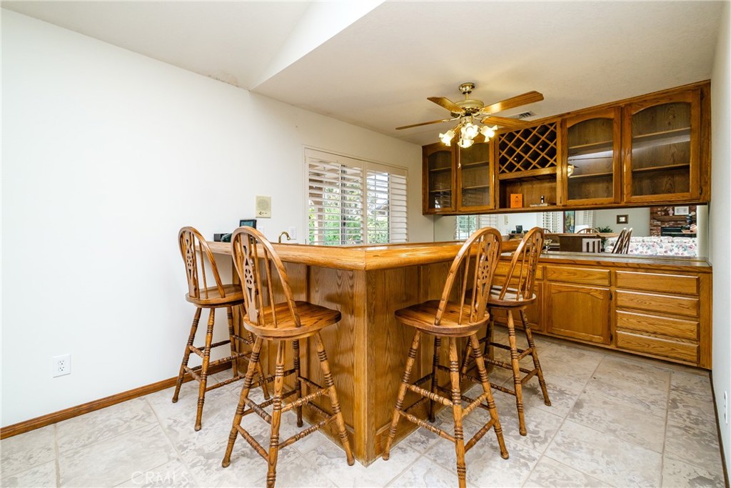 19670 Tonkawan Road Apple Valley, CA 92307 - Photo 5 of 29 a view of a dining room with furniture and chandelier