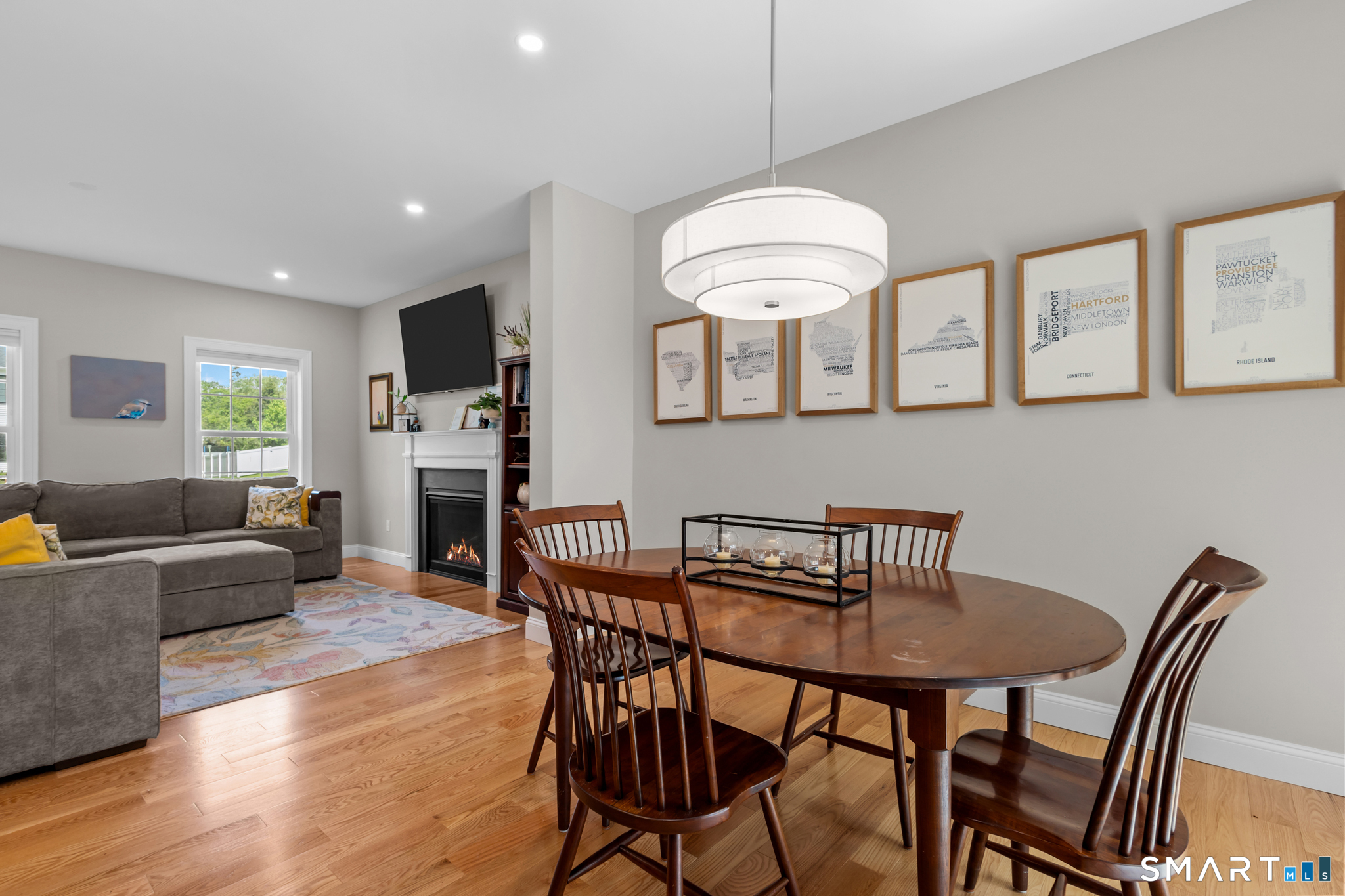 2 Martys Way Gales Ferry, CT 06335 - Photo 5 of 40 a view of a dining room with furniture wooden floor and chandelier