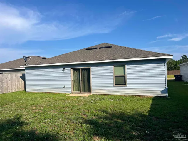 a house with garden in front of it