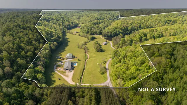 a view of a lake with a house in the background