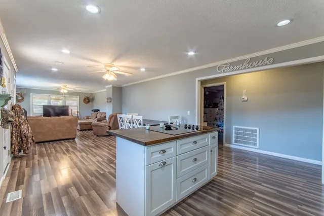 a spacious bathroom with double vanity sink a mirror and a shower