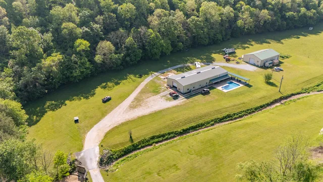a view of a dining room and kitchen with furniture and a clock