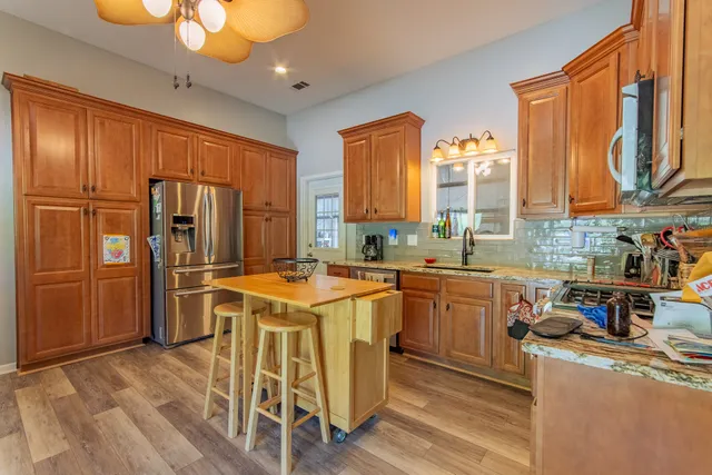 a view of a yard with lots of trees