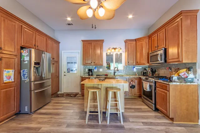 a view of a backyard of the house