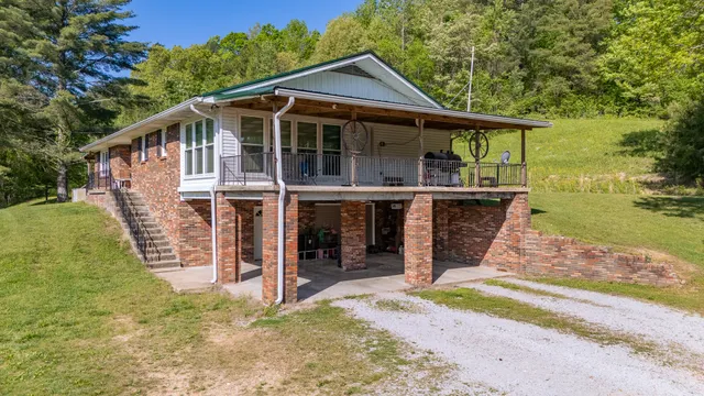 a kitchen with stainless steel appliances granite countertop a stove a sink dishwasher and a refrigerator