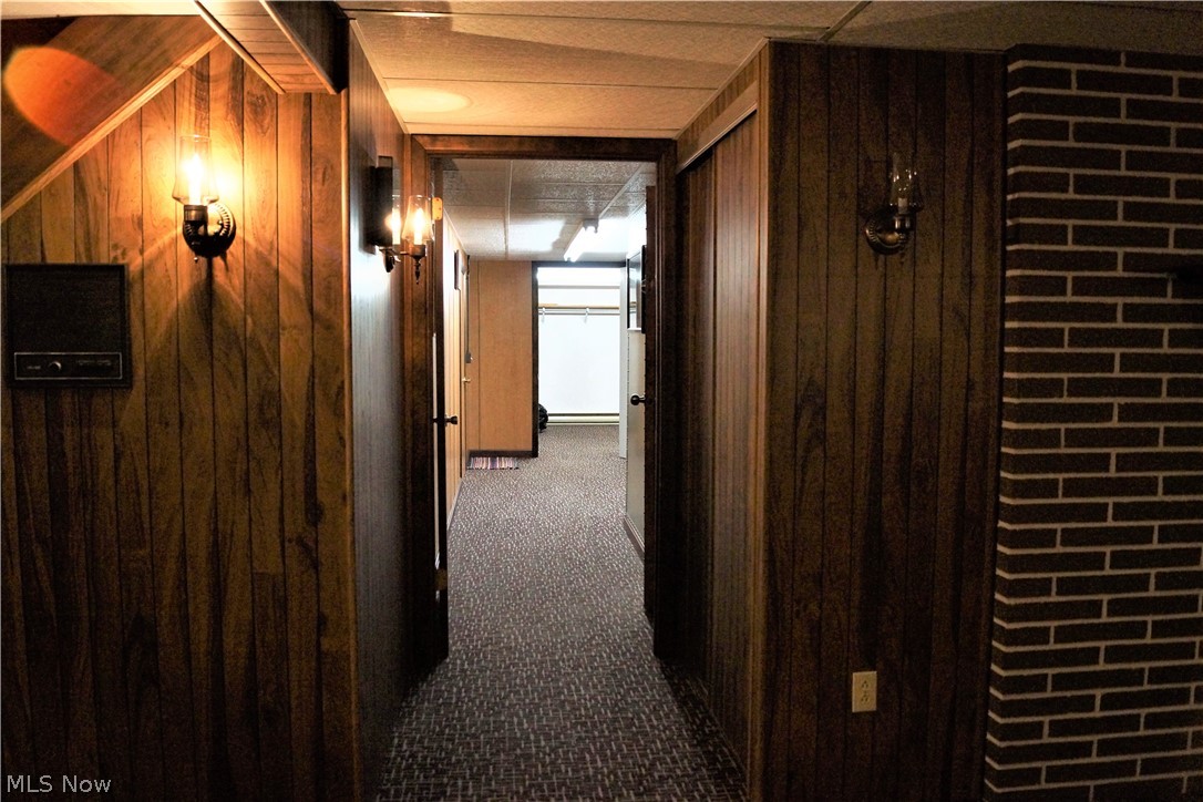 89640 Fairview Road Jewett, OH 43986 - Photo 23 of 34 HALLWAY FROM THE LOWER LEVEL FAMILY ROOM LOOKING BACK TO THE "SAFE ROOM" AND AMPLE STORAGE ROOMS