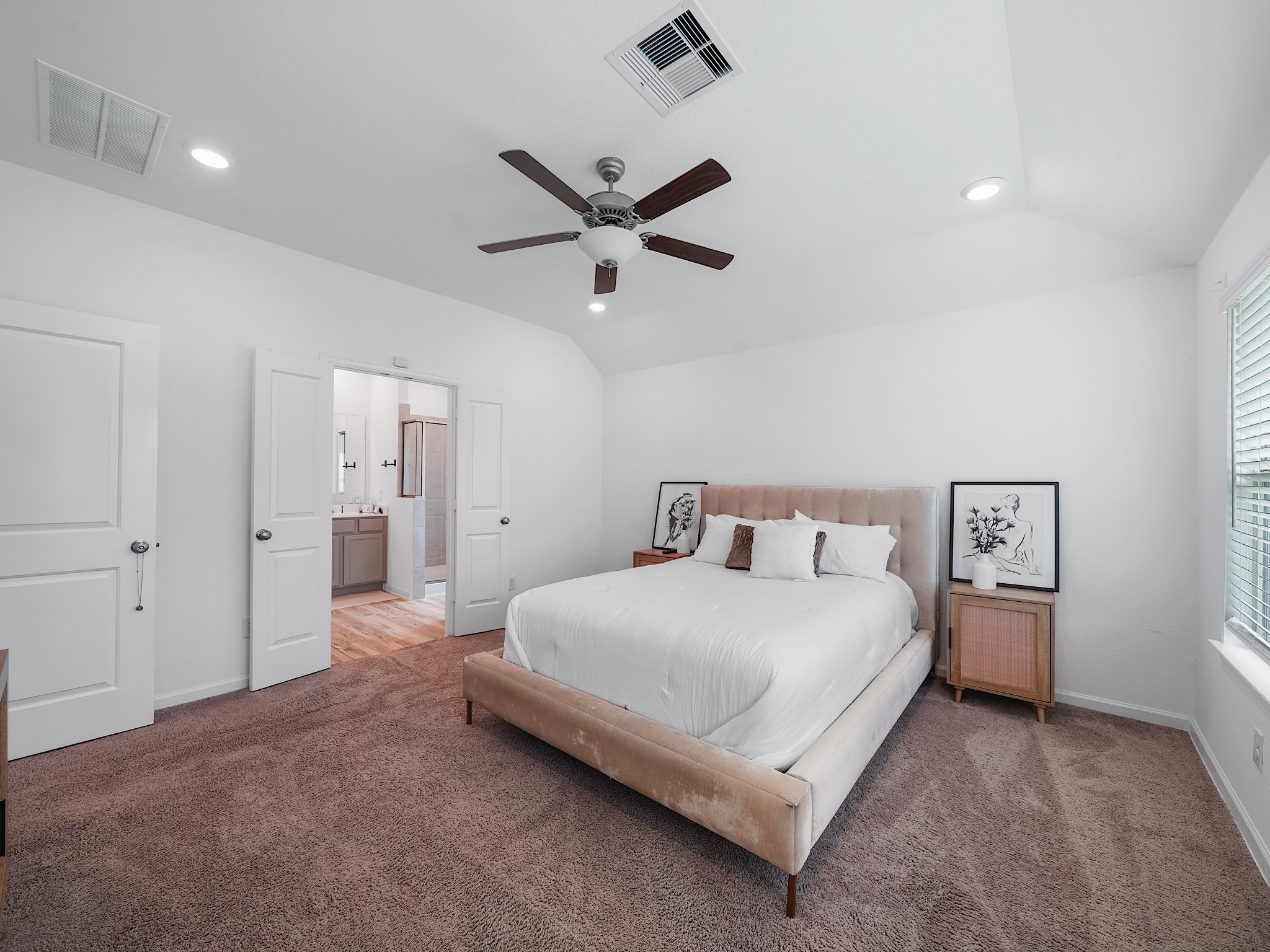 6210 Glenwick Park Road Katy, TX 77493 - Photo 15 of 25 Retreat to comfort with this serene primary bedroom, complete with direct access to the spa-inspired ensuite bath through elegant double doors.