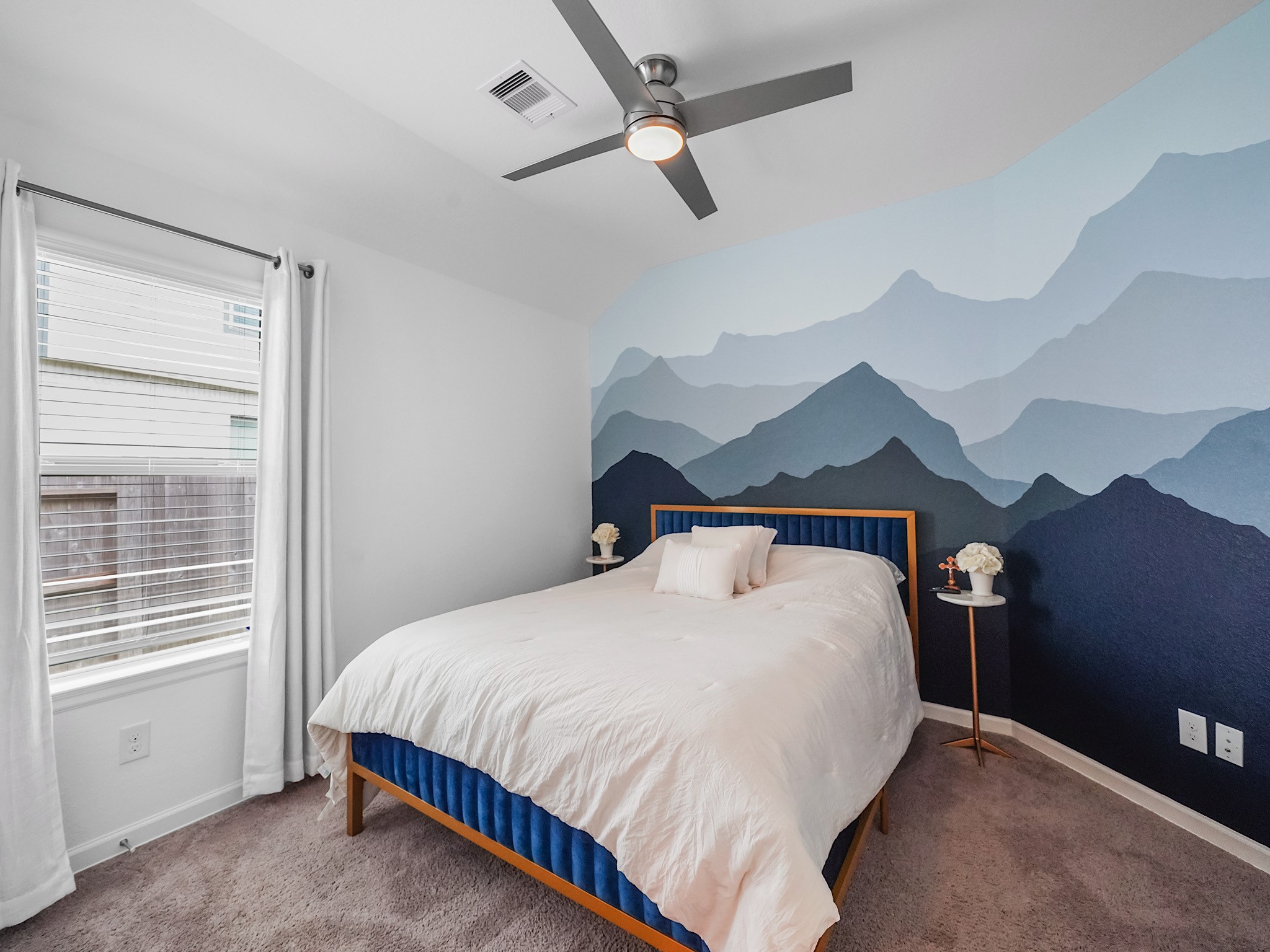 6210 Glenwick Park Road Katy, TX 77493 - Photo 19 of 25 Add a pop of personality! This secondary bedroom features a striking mountain mural accent wall, making it a great fit for a guest room, creative space, or bedroom!