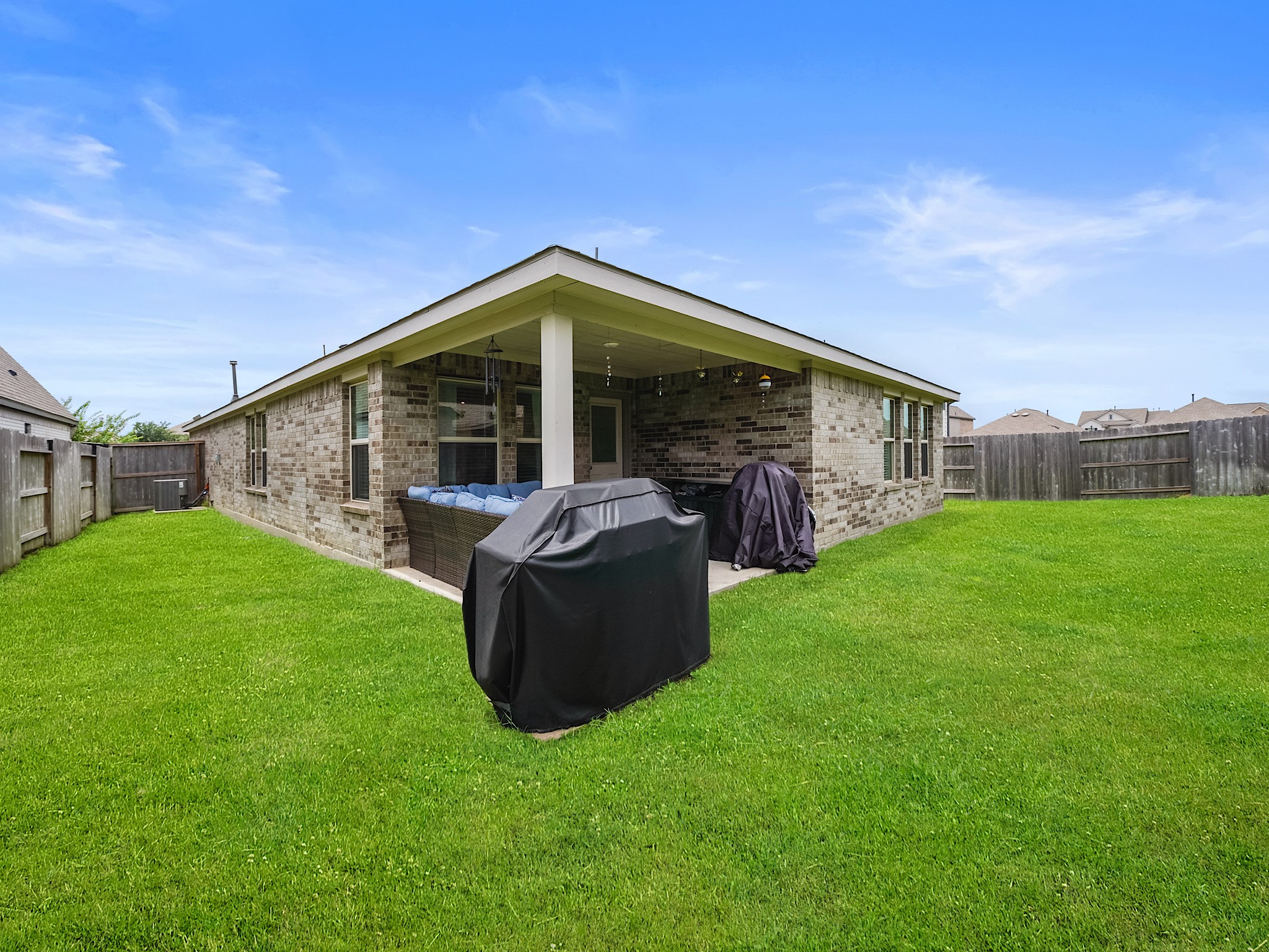 6210 Glenwick Park Road Katy, TX 77493 - Photo 24 of 25 Enjoy the open space of this fully fenced backyard—ideal for outdoor relaxation or entertaining under the spacious covered patio.