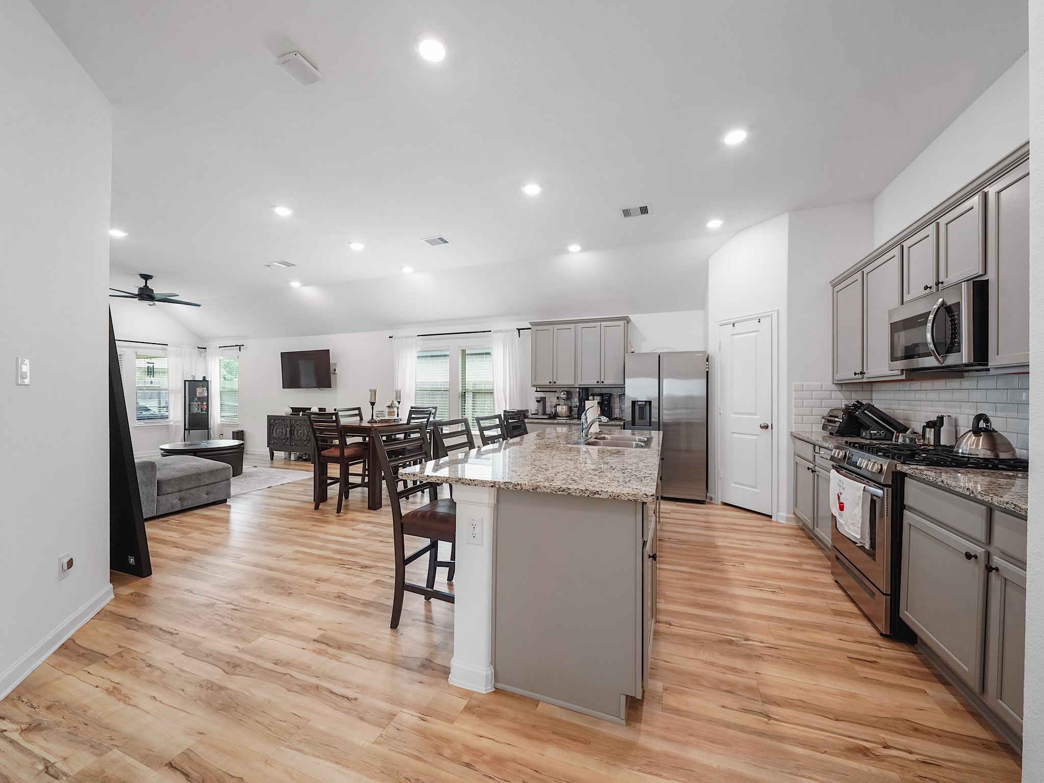 6210 Glenwick Park Road Katy, TX 77493 - Photo 3 of 25 The heart of the home shines in this open-concept layout where the kitchen, dining, and living areas flow together seamlessly—ideal for entertaining, family gatherings, or simply relaxing at home.