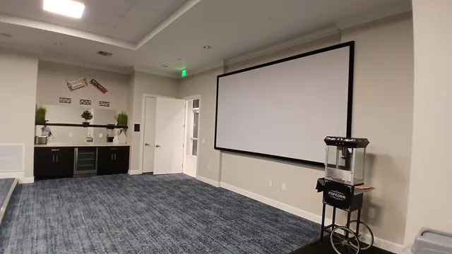 a room with a bed and a dresser