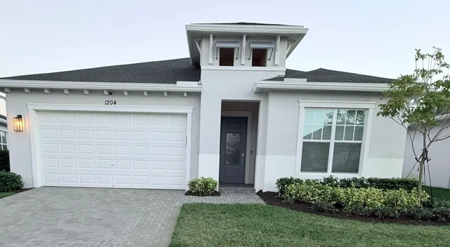 a house view with a garden space