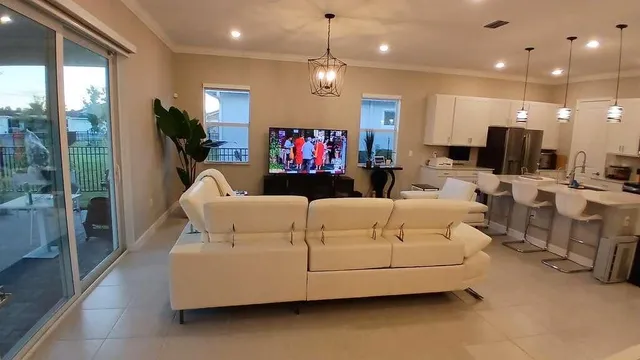 a living room with furniture and a flat screen tv