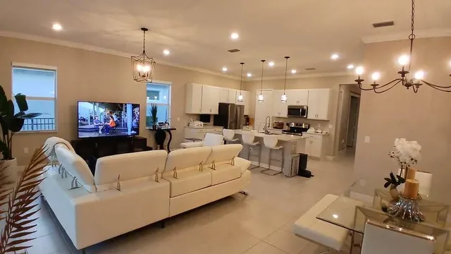 a living room with furniture and a flat screen tv