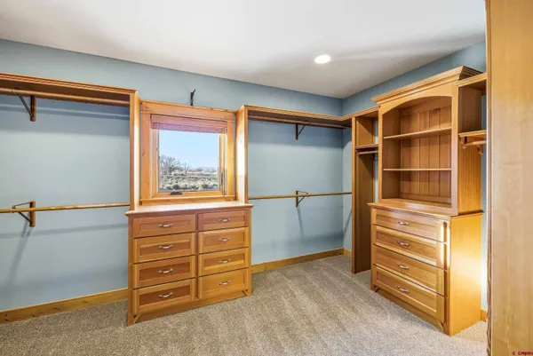 a view of an empty room with a cabinet