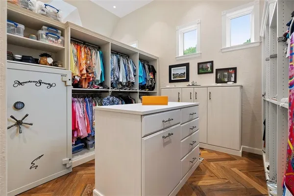 a view of kitchen island with furniture and refrigerator