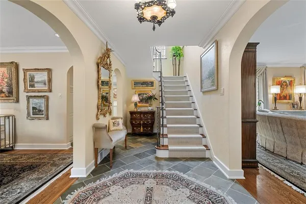 a view of an entryway with wooden floor