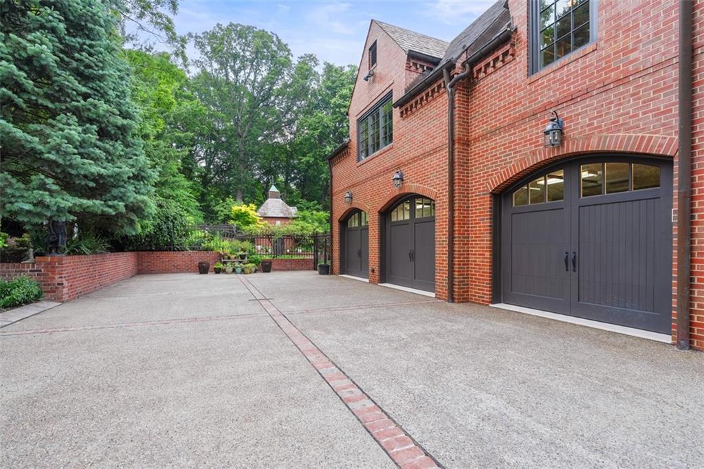 1909 Highgate Road Pittsburgh, PA 15241 - Photo 45 of 47 a front view of a house with a yard and garage