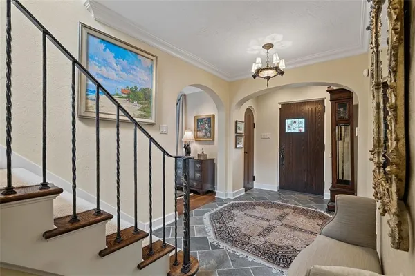 a view of a livingroom with hardwood floor and staircase