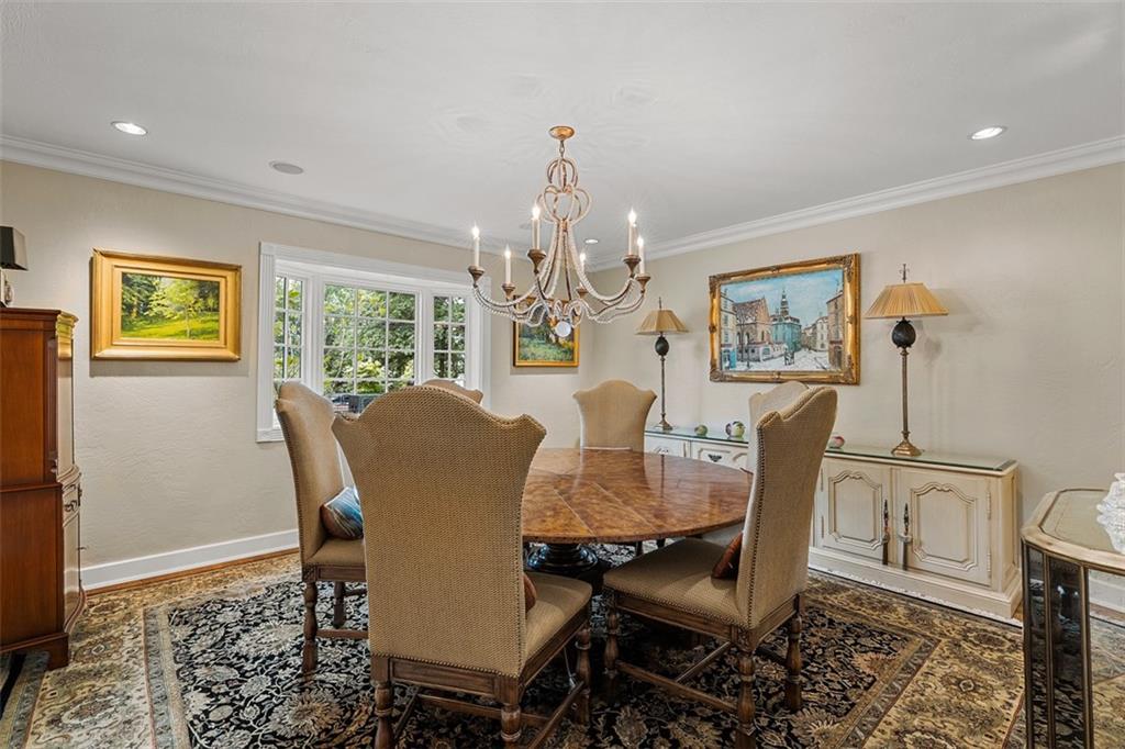 1909 Highgate Road Pittsburgh, PA 15241 - Photo 8 of 47 a view of a dining room with furniture a chandelier and wooden floor