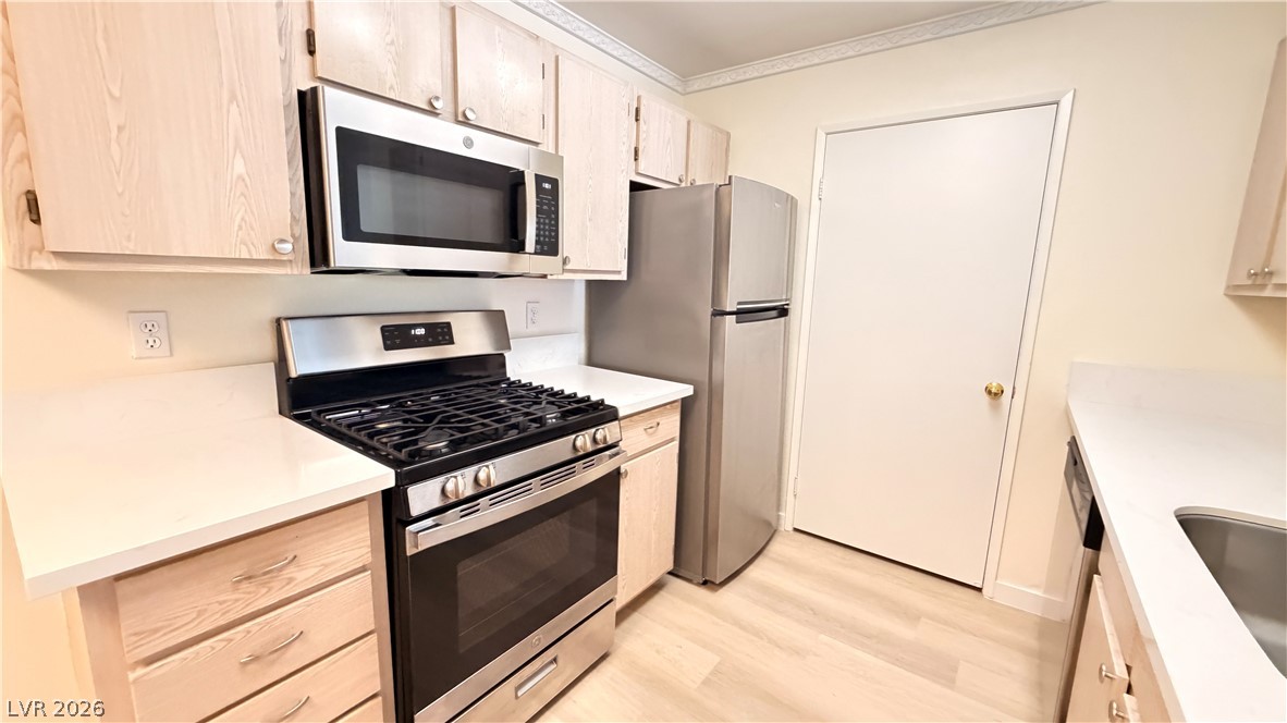 7885 West Flamingo Road, Unit 1131 Las Vegas, NV 89147 - Photo 16 of 36 A compact kitchen with stainless steel appliances and ample counter space awaits your culinary creations.