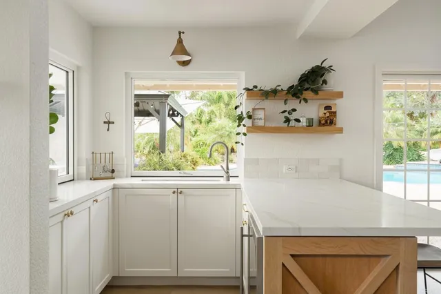 a bathroom with a sink and a window