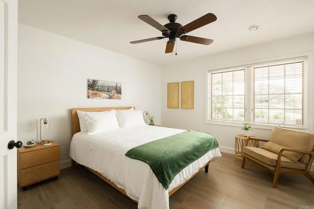 a bedroom with a bed and a couch