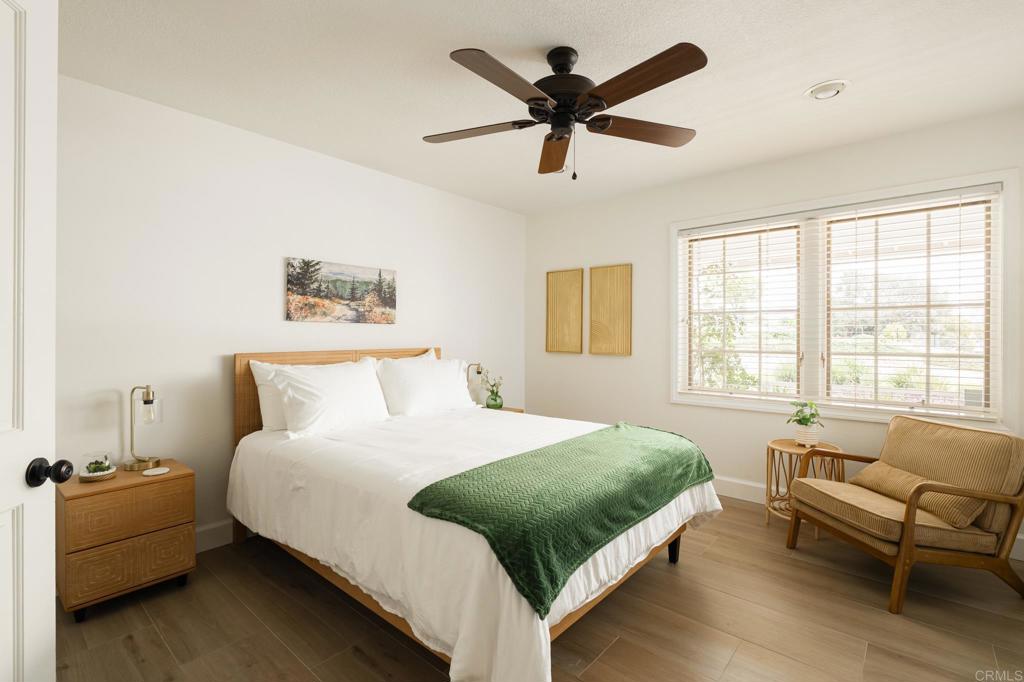 12212 Rockstream Road Lakeside, CA 92040 - Photo 17 of 36 a bedroom with a bed and a couch