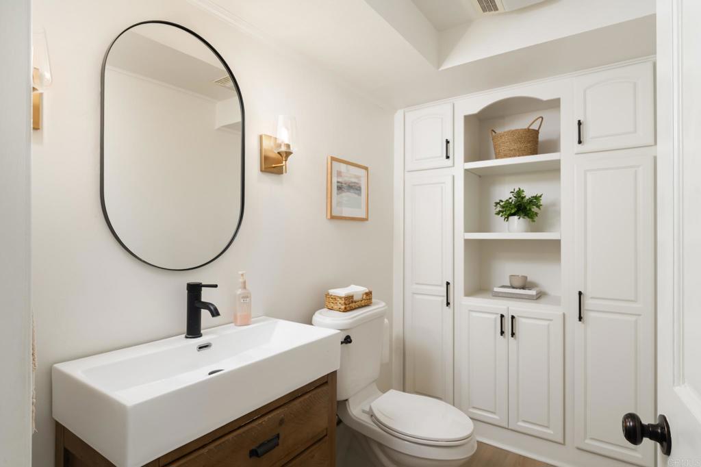 12212 Rockstream Road Lakeside, CA 92040 - Photo 18 of 36 a bathroom with a sink a toilet and a mirror