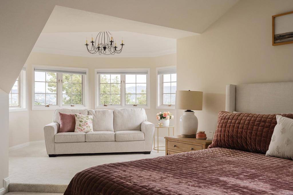 12212 Rockstream Road Lakeside, CA 92040 - Photo 20 of 36 a bedroom with a large bed and a couch