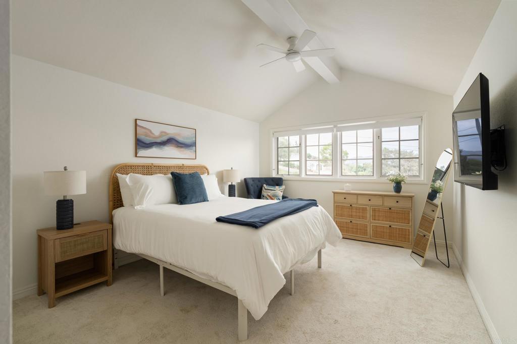 12212 Rockstream Road Lakeside, CA 92040 - Photo 22 of 36 a bedroom with a bed and a flat tv screen on the dresser