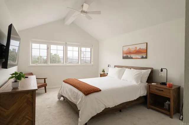 a bedroom with a bed and a couch