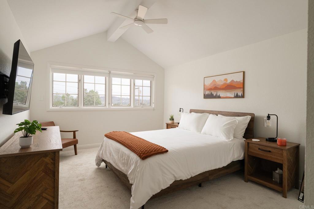 12212 Rockstream Road Lakeside, CA 92040 - Photo 24 of 36 a bedroom with a bed and a couch