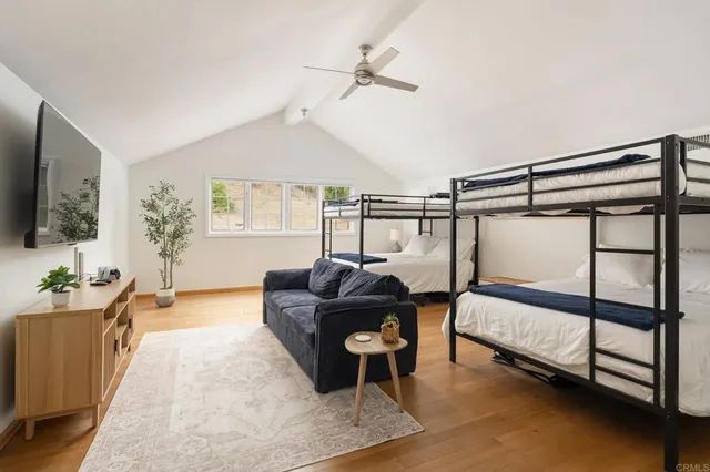 a bedroom with furniture and a window