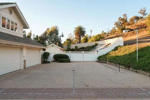 a view of a house with a yard and garage