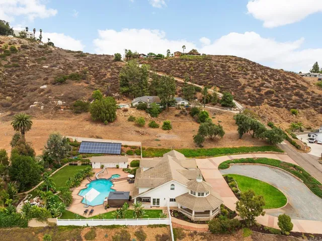 an aerial view of a house with a garden