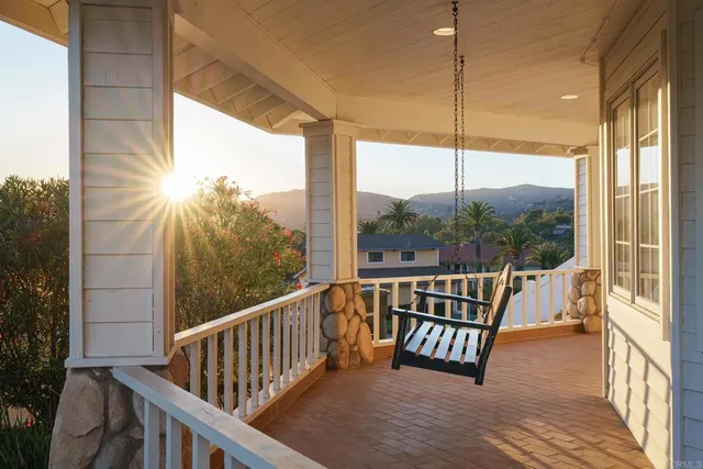 a view of balcony with wooden floor