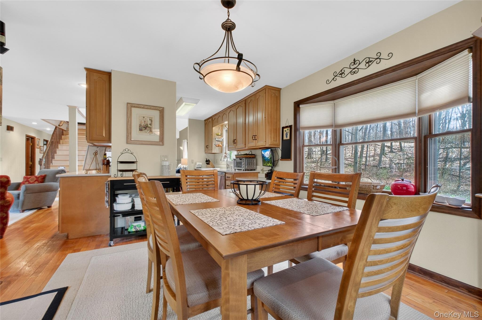 256 Overlook Road Poughkeepsie, NY 12603 - Photo 13 of 47 a dining room with furniture a chandelier and wooden floor
