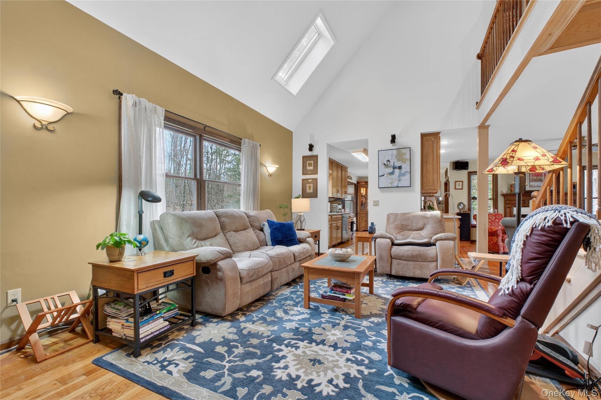 256 Overlook Road Poughkeepsie, NY 12603 - Photo 18 of 47 a living room with furniture ceiling fan and a rug