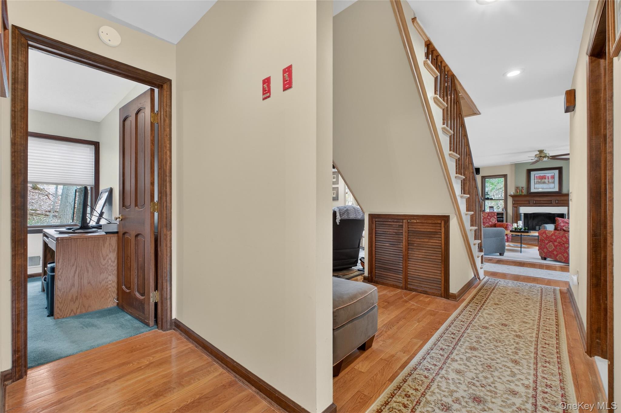 256 Overlook Road Poughkeepsie, NY 12603 - Photo 22 of 47 a view of a hallway view with living room and wooden floor