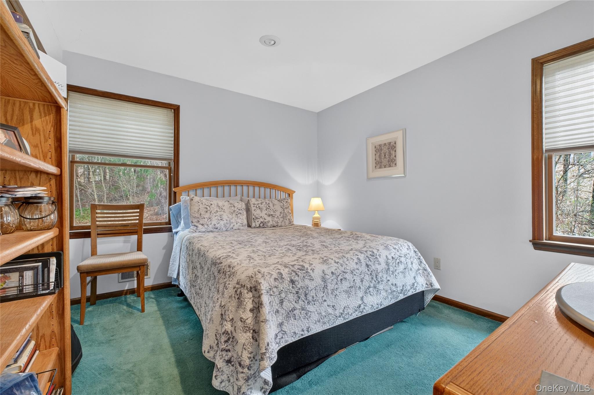 256 Overlook Road Poughkeepsie, NY 12603 - Photo 23 of 47 a bedroom with a bed a table and chair