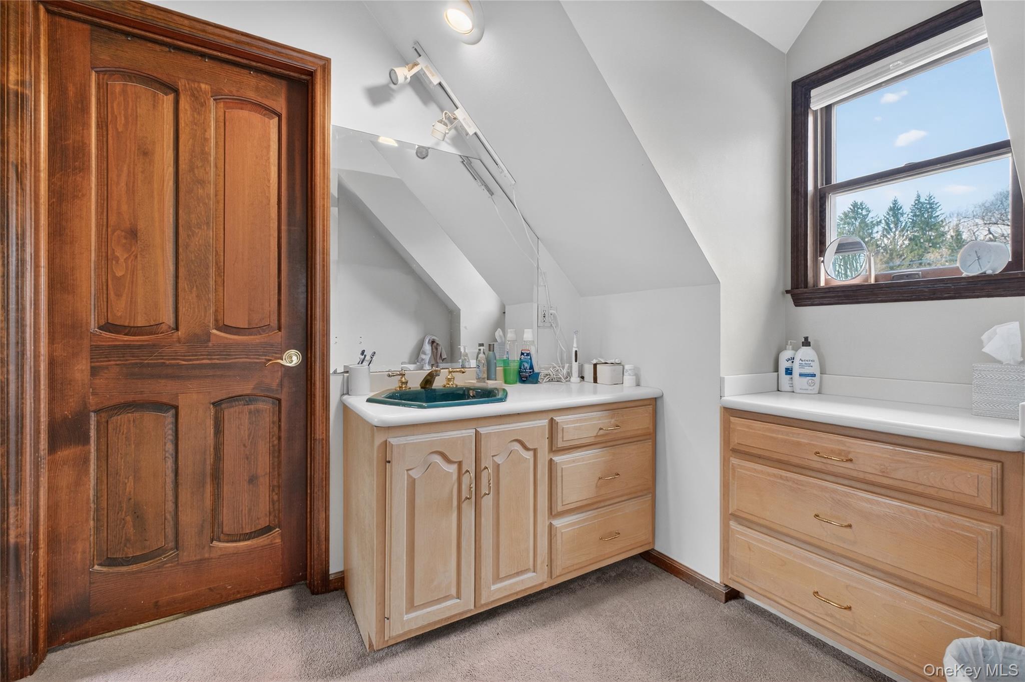 256 Overlook Road Poughkeepsie, NY 12603 - Photo 33 of 47 a bathroom with a sink a vanity and a mirror